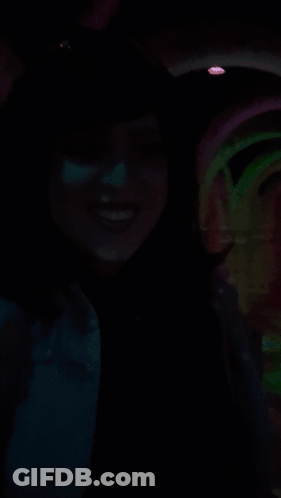 A Woman In A Dark Room With The Words No Shagrita On The Bottom Right GIF