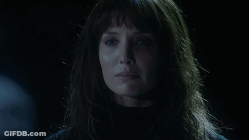 A Woman In A Dark Room With The Words " Not Anymore " Behind Her GIF