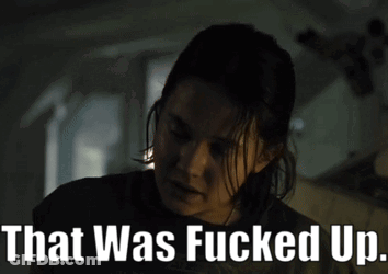A Woman In A Dark Room With The Words That Was Fucked Up Above Her GIF
