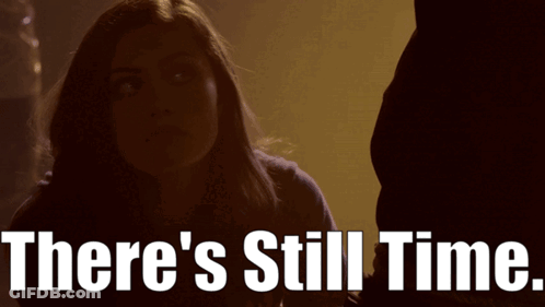 A Woman In A Dark Room With The Words There 'S Still Time GIF