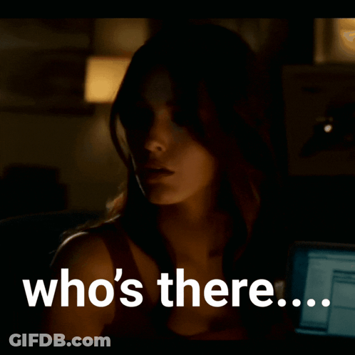 A Woman In A Dark Room With The Words Who 'S There On The Bottom GIF