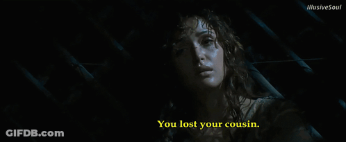 A Woman In A Dark Room With The Words You Lost Your Cousin Below Her GIF