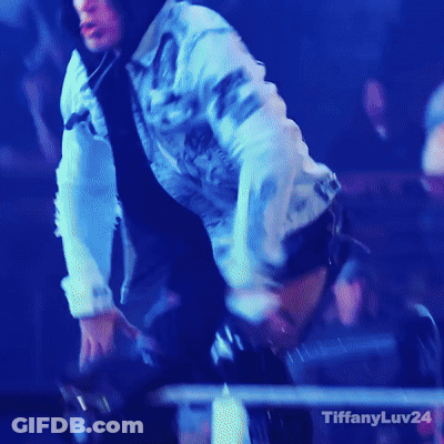 A Woman In A Denim Jacket Is Dancing In Front Of A Crowd And The Words Tiffanyluv24 Are On The Bottom GIF