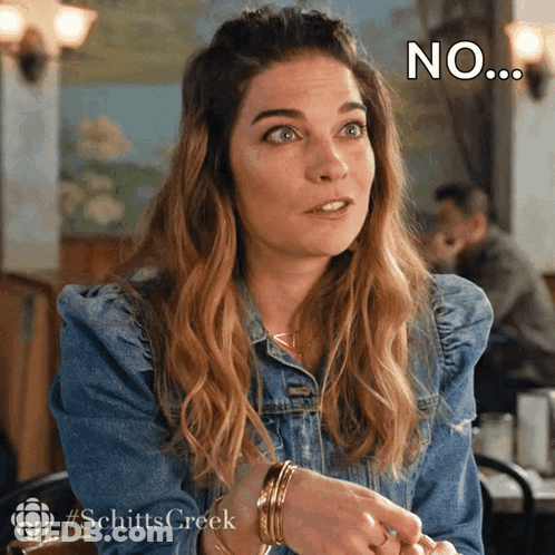 Woman In Denim Jacket Sitting With No Face GIF
