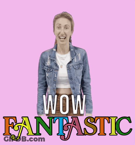 A Woman In A Denim Jacket Is Standing In Front Of The Words Wow Fantastic GIF