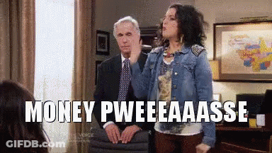 Woman In Denim Jacket Next To Man In Suit GIF