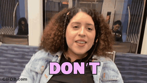 A Woman In A Denim Jacket Says " Don 'T " GIF