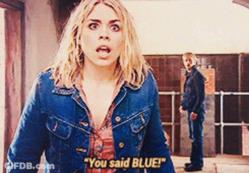 A Woman In A Denim Jacket Says " You Said Blue " While A Man Stands Behind Her GIF