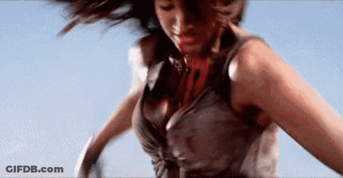 A Woman In A Dirty Dress Is Jumping In The Air . GIF