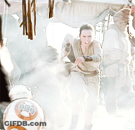A Woman In A Dress Is Fighting A Bb-8 Robot GIF