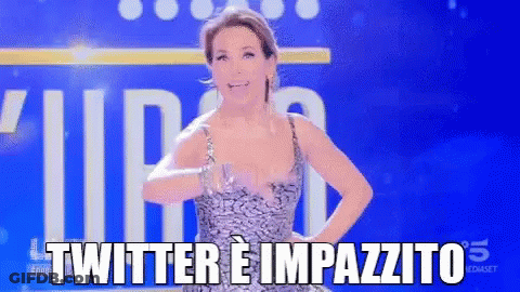 A Woman In A Dress Is Standing In Front Of A Blue Background That Says Twitter E Impazzito GIF