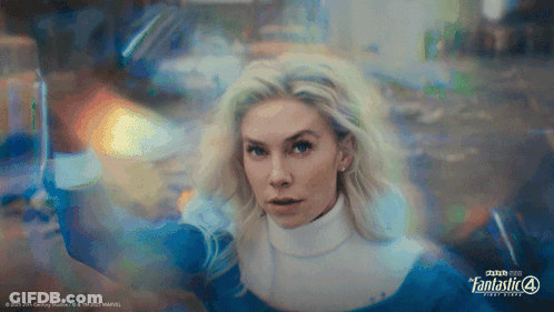 A Woman In A Fantastic 4 Costume Is Holding A Sword GIF