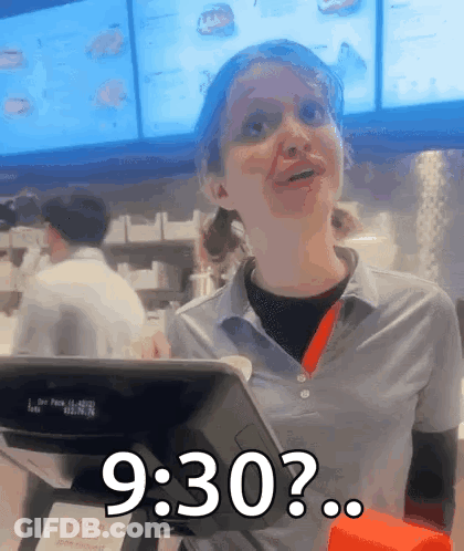 A Woman In A Fast Food Restaurant Behind A Counter Says 9:30 GIF