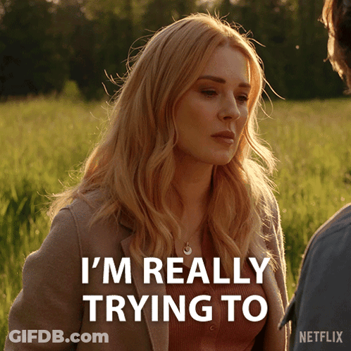 A Woman In A Field With The Words I 'M Really Trying To GIF