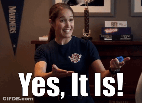 A Woman In A Firefighter Shirt Is Holding A Blue Object And Says Yes It Is GIF