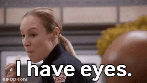 A Woman In A Firefighter Uniform Is Eating A Piece Of Food And Says `` I Have Eyes . '' GIF