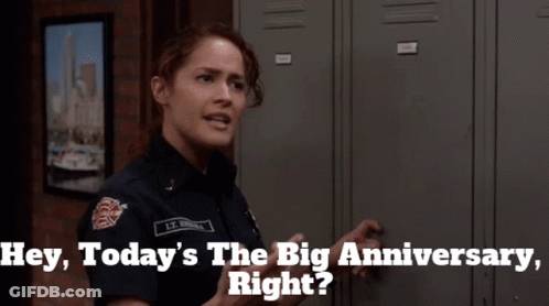 A Woman In A Firefighter Uniform Says " Hey Today 'S The Big Anniversary " GIF