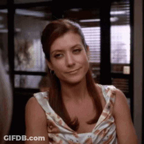 Woman In Floral Dress Smiling For Camera GIF