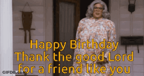 A Woman In A Floral Dress Is Standing In Front Of A Door With The Words Happy Birthday Thank The Good Lord For A Friend GIF