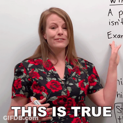 A Woman In A Floral Shirt Is Pointing At A White Board And Says This Is True GIF