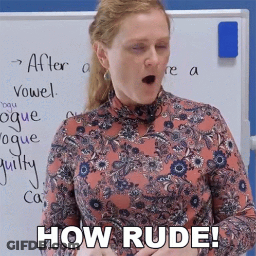 A Woman In A Floral Shirt Says How Rude In Front Of A Whiteboard GIF