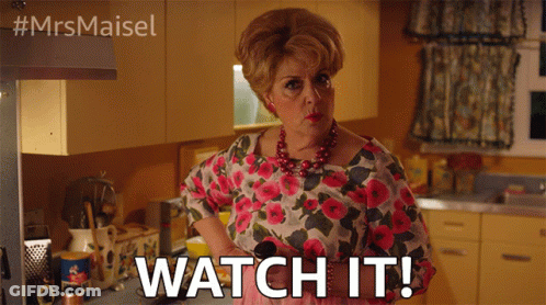 A Woman In A Floral Shirt Says Watch It In A Kitchen GIF