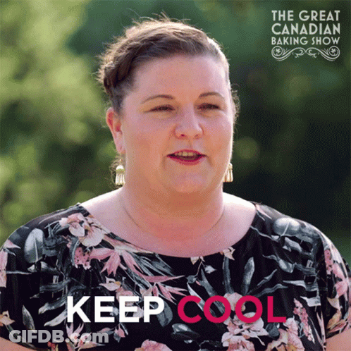 A Woman In A Floral Shirt Stands In Front Of A Sign That Says " Keep Cool " GIF