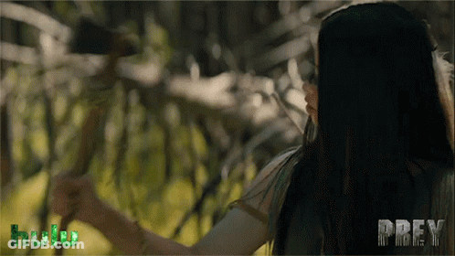 A Woman In A Forest With The Word Prey On The Bottom GIF