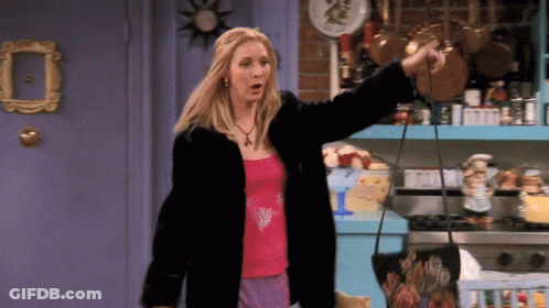 A Woman In A Fur Coat Is Holding A Purse In Her Hand GIF