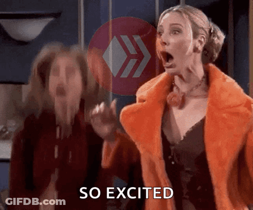 A Woman In A Fur Coat Says So Excited Next To Another Woman GIF