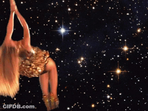 A Woman In A Gold Dress Is Dancing In The Stars GIF