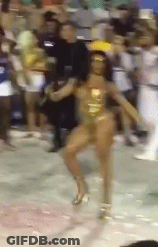 A Woman In A Gold Swimsuit Is Dancing In Front Of A Crowd GIF