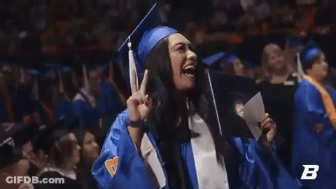 A Woman In A Graduation Cap And Gown Is Holding A Diploma With The Letter B In The Corner GIF