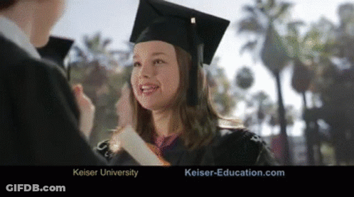 A Woman In A Graduation Cap And Gown Is Smiling And Holding A Diploma GIF