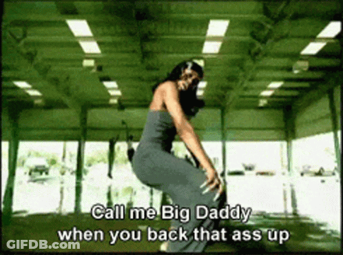 A Woman In A Gray Dress Is Squatting Down With The Words Call Me Big Daddy When You Back That Ass Up GIF