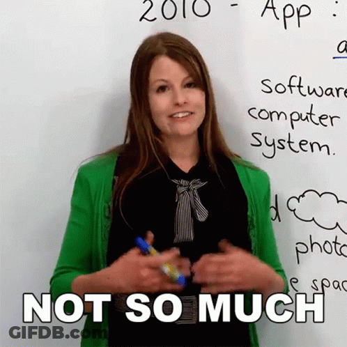 A Woman In A Green Cardigan Stands In Front Of A White Board That Says 2010 App Software Computer System GIF