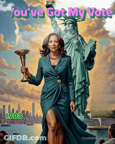 A Woman In A Green Dress Holds A Torch In Front Of A Statue Of Liberty GIF