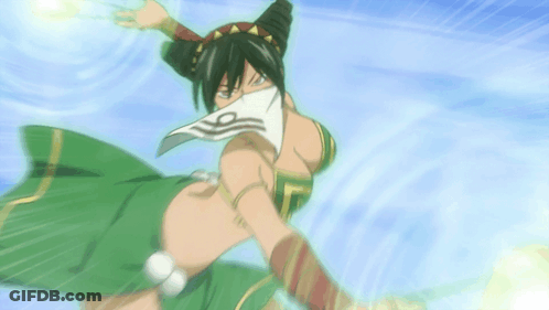 A Woman In A Green Dress With A White Scarf Around Her Face GIF