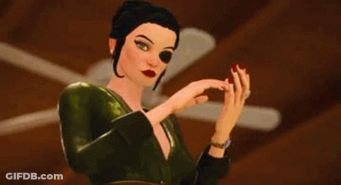 A Woman In A Green Dress With Red Nails Is Clapping Her Hands . GIF