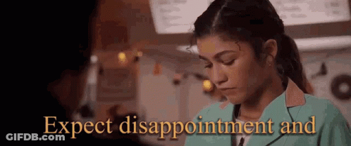A Woman In A Green Jacket Is Looking Down And The Words `` Expect Disappointment And '' Are Behind Her . GIF