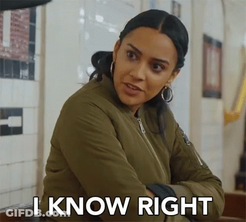 A Woman In A Green Jacket Is Sitting At A Table With Her Arms Crossed And Says `` I Know Right '' . GIF