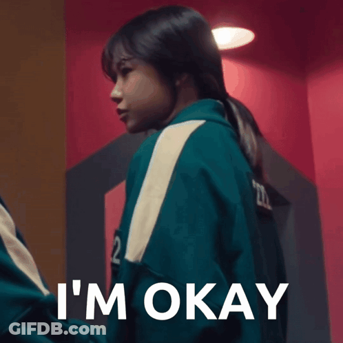 A Woman In A Green Jacket With The Number 22 On It Says I 'M Okay GIF