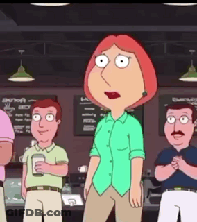 A Woman In A Green Shirt Is Standing In Front Of A Group Of Men . GIF