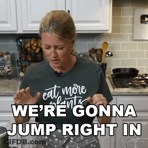 A Woman In A Green Shirt That Says " Eat More Plants " Says We 'Re Gonna Jump Right In GIF