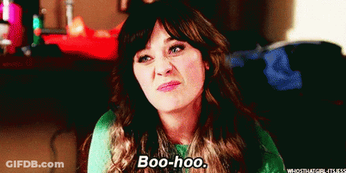 A Woman In A Green Sweater Is Making A Funny Face And Saying Boo-Hoo . GIF