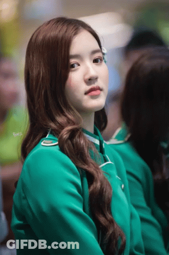 A Woman In A Green Uniform Has The Word Bmw Written On Her Shoulder GIF