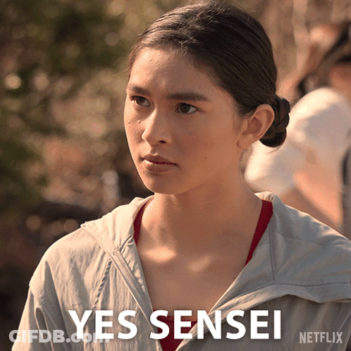 A Woman In A Grey Jacket Says Yes Sensei On The Bottom GIF