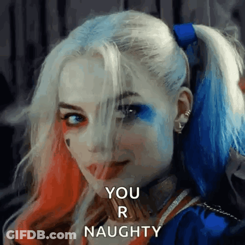 Woman In Harley Quinn Costume Smiling Naughty GIF