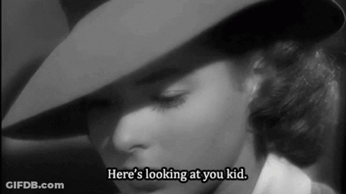 A Woman In A Hat Says Here 'S Looking At You Kid . GIF