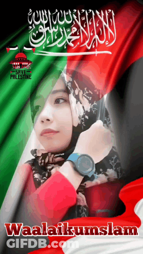 A Woman In A Hijab Stands In Front Of A Flag With Waalaikumslam Written On It GIF